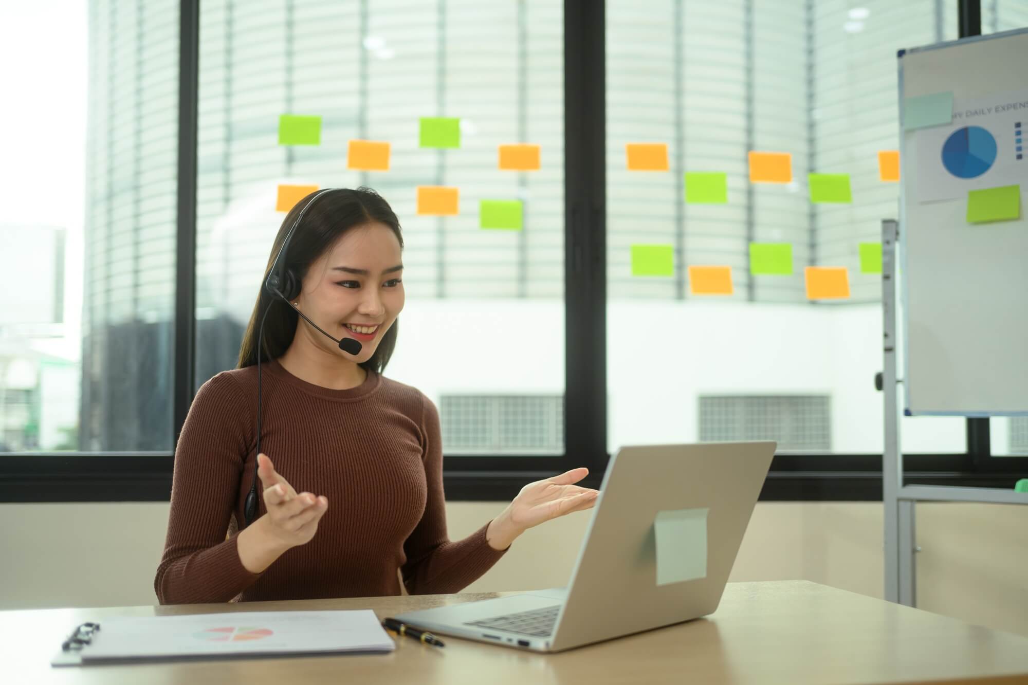 customer-service-representative-in-headset-consulting-for-digital-marketing-with-client.jpg